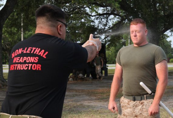Sprayed in the face with Oleoresin Capsicum before undergoing the OC spray certification course being held aboard the Marine Corps Base Camp 570x390