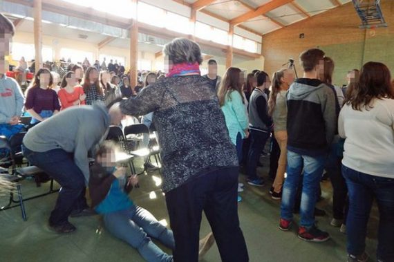 Student who fell to the ground during mass exorcism 570x379