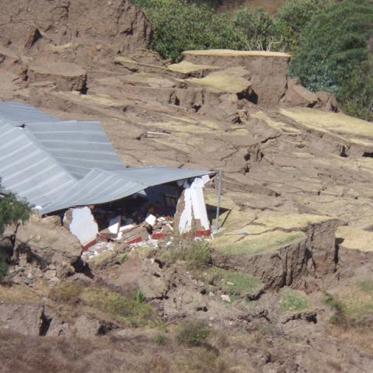 Earth Swallows Houses and Cars and Spews Flaming Water