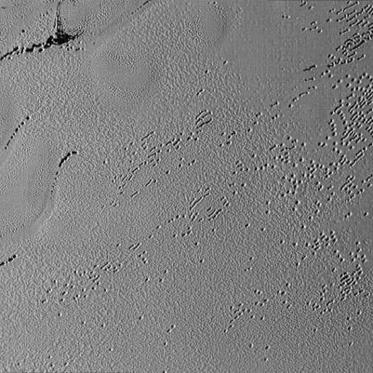 Mysterious Potholes on Pluto and Pyramids on its Moon