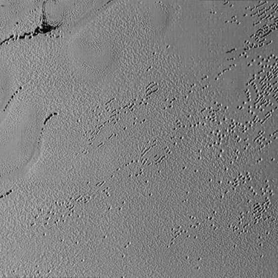 Mysterious Potholes on Pluto and Pyramids on its Moon