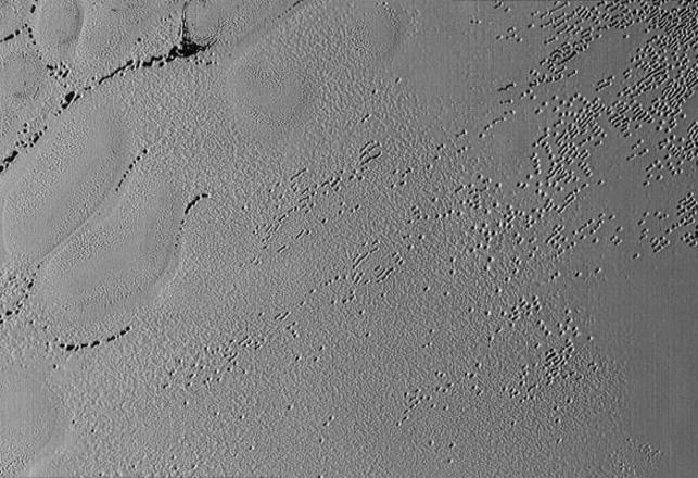 Mysterious Potholes on Pluto and Pyramids on its Moon