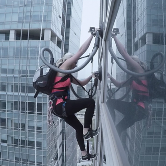 Climber Scales Skyscraper Using Battery-Powered Vacuum Cleaners
