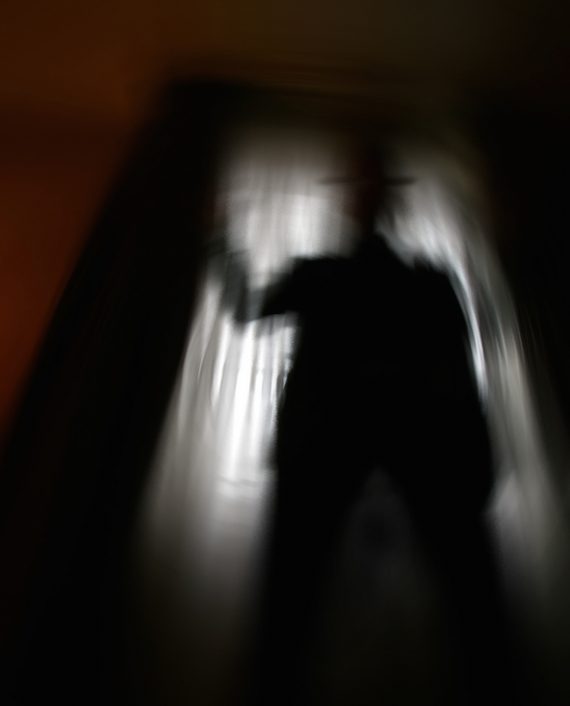 man shot against the light of a window (slow shutter speed, the man been on the picture for only part of the exposure and therefore a bit transparent)
