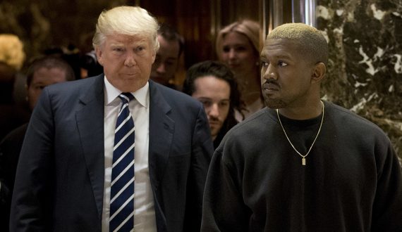 Kanye West and President-elect Donald Trump arrive to the lobby of Trump Tower in New York, Tuesday, Dec. 13, 2016. (AP Photo/Seth Wenig)