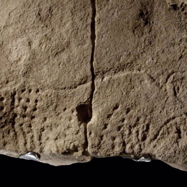 Paleolithic Rock Carving in France Contains Strange Symbols