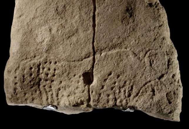 Paleolithic Rock Carving in France Contains Strange Symbols