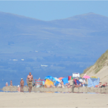 UFOs Are Reportedly Spying on a Nudist Beach in Wales