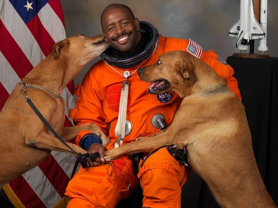 NASA astronaut Leland D Melvin with his dogs Jake and Scout thumb 560x448 570x428