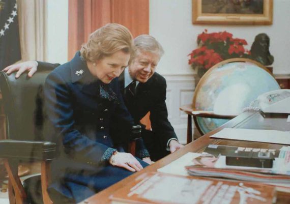 Thatcher at Oval Office desk with Carter 570x401